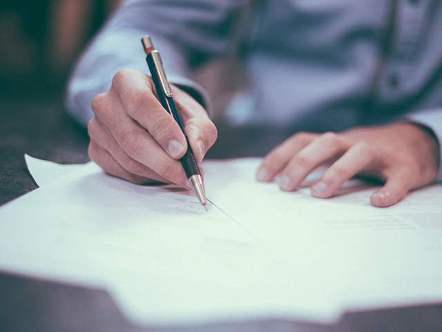 Let us keep your books with our general accounting services Amplify Capital working on a spreadsheet for a client